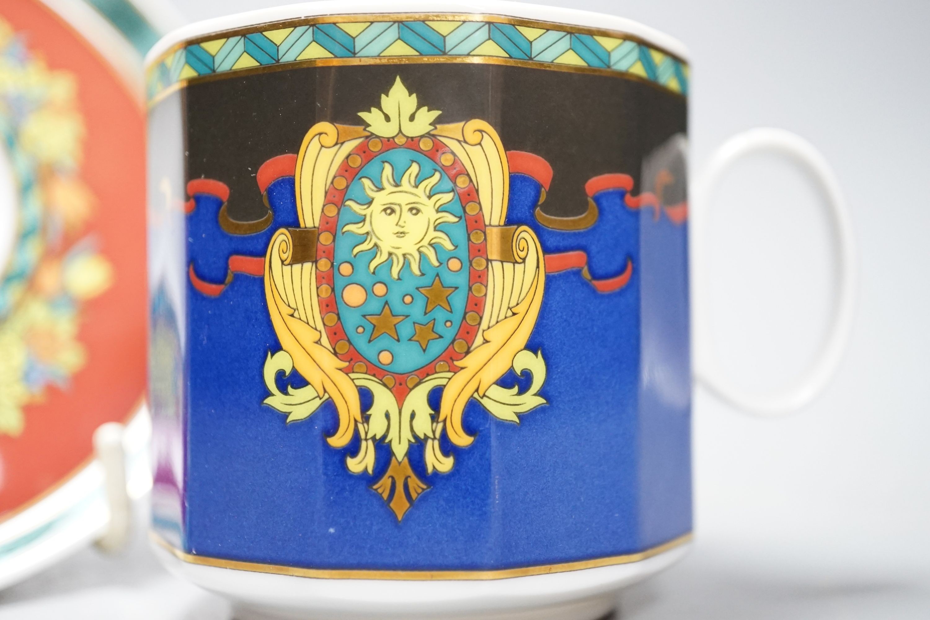 A set of eight Versace 'Le Roi Soleil' pattern cups and saucers